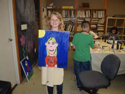 a person holding a drawing