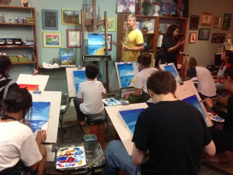 a group of people sitting at computers