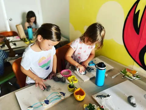 a couple of young girls painting