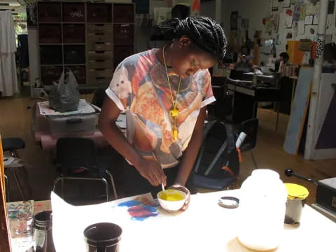 a man painting a table