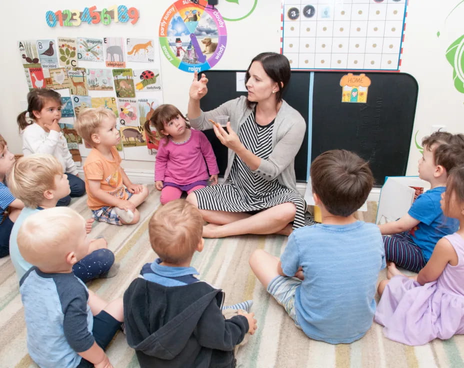 a person teaching a group of children