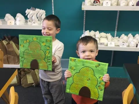 a couple of boys holding books