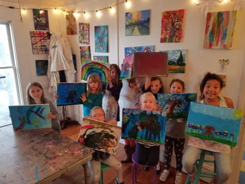 a group of children holding books