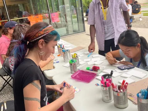 a group of people painting