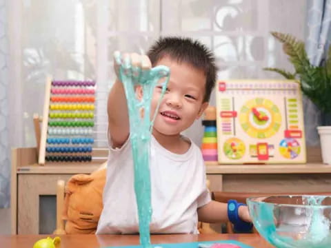 a child holding a plastic tube