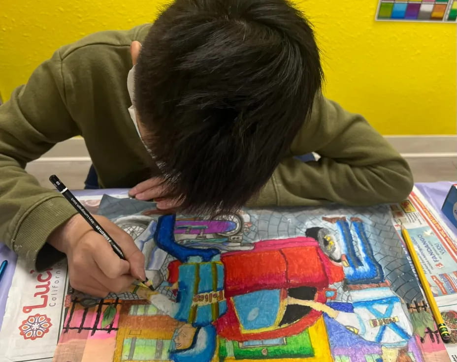 a person sitting at a table with a board game