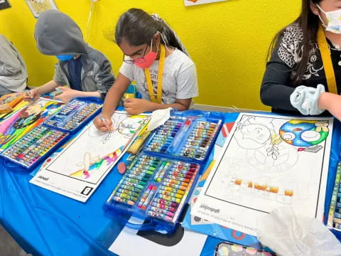 a group of people painting