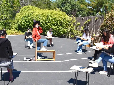 a group of people sitting on benches