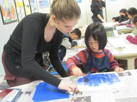 a person and a child in a classroom