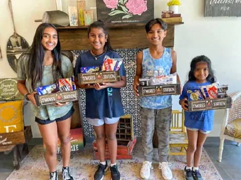 a group of girls holding signs