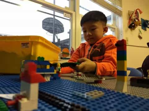 a boy playing with toys