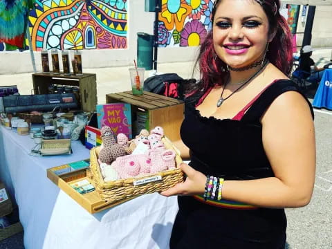 a woman holding a tray of cookies