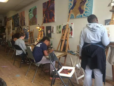 a group of people painting