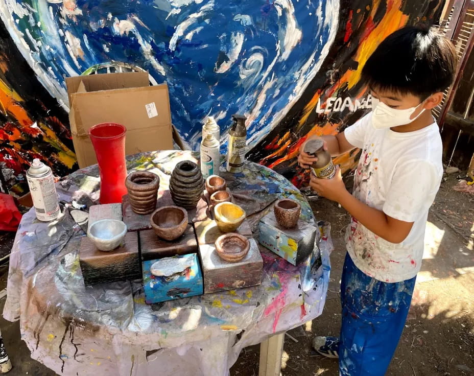 a person painting a table