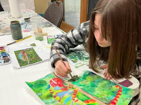 a person painting on a table