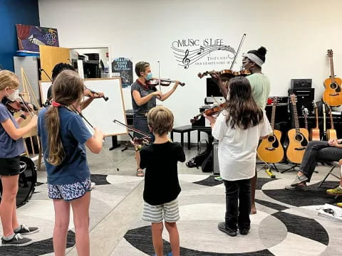 a group of people playing instruments