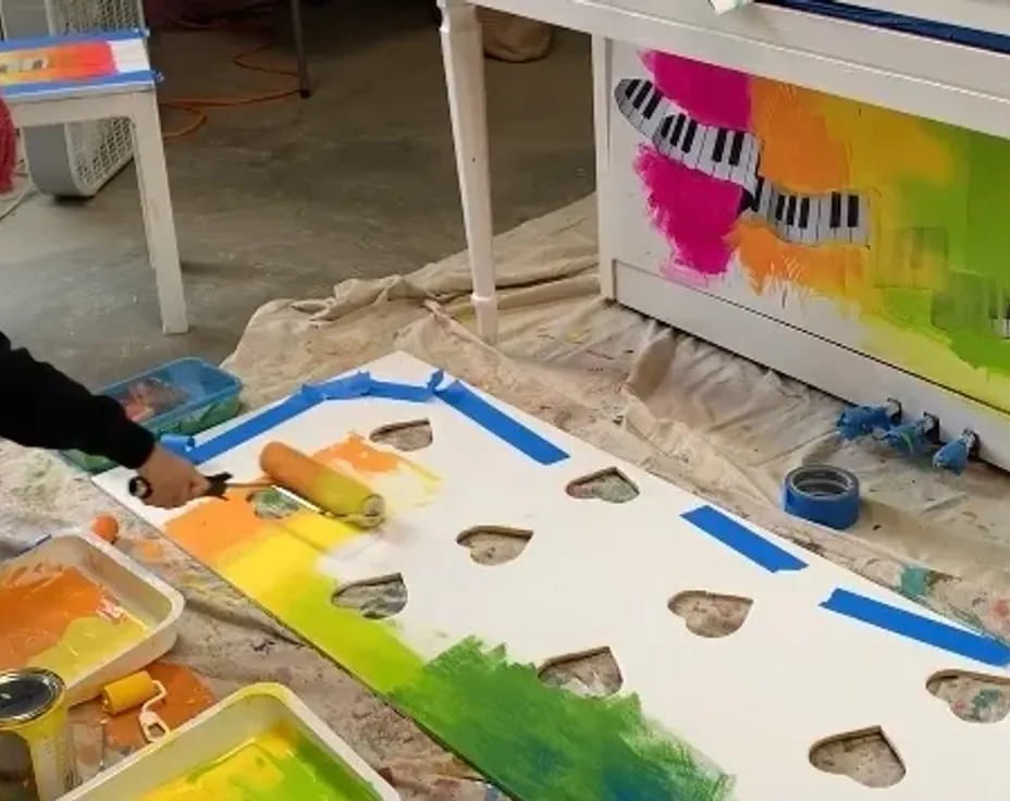 a person painting on a table