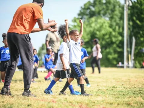 a group of kids playing football