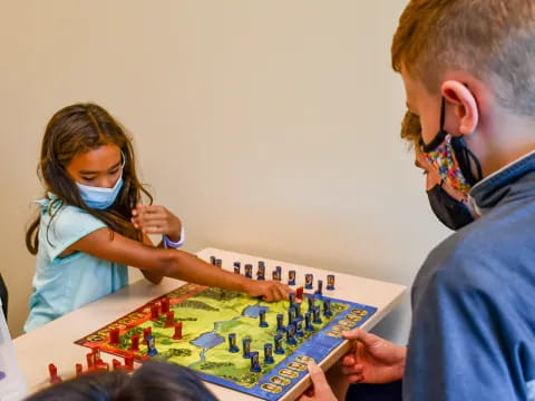 a man and a woman playing a board game