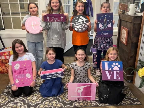 a group of children holding signs