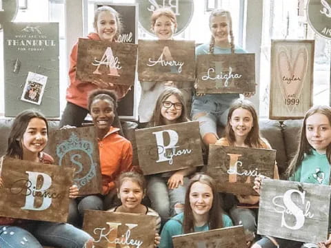 a group of people holding books