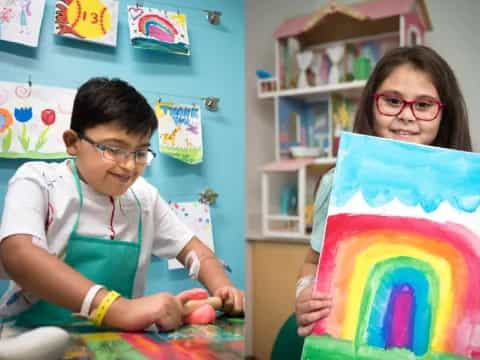 a couple of kids painting