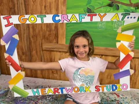 a girl sitting in a play structure