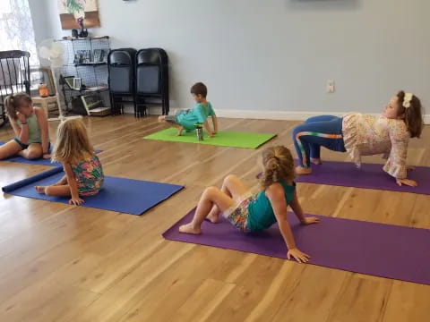 a group of children doing yoga