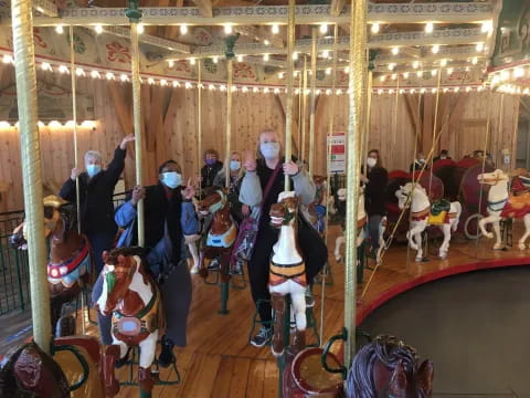 a group of people on a carousel