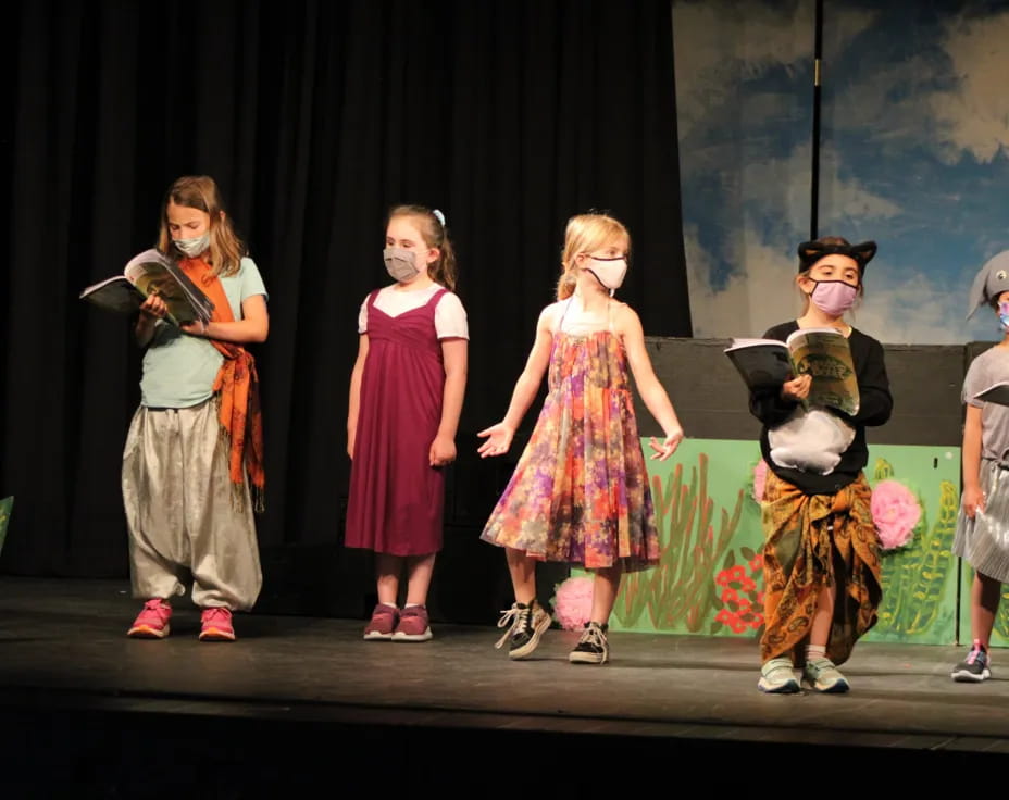 a group of children on a stage