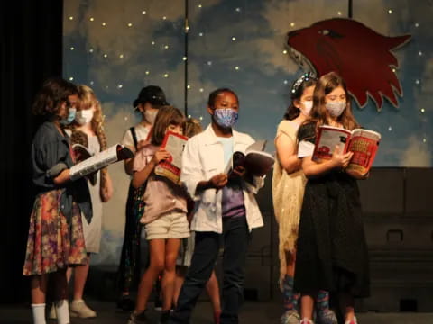 a group of people wearing masks and holding books