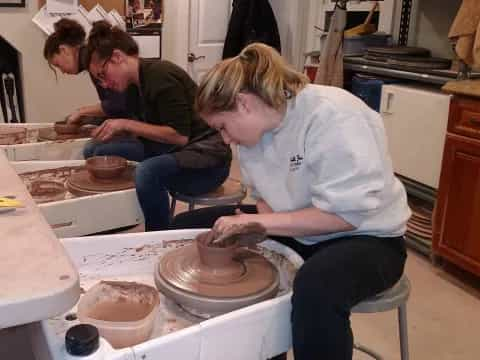 a group of people working in a kitchen