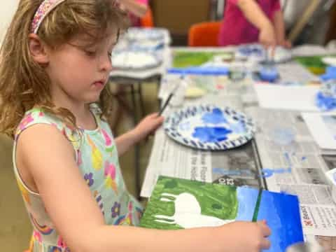 a young girl painting