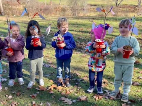 a group of children holding objects