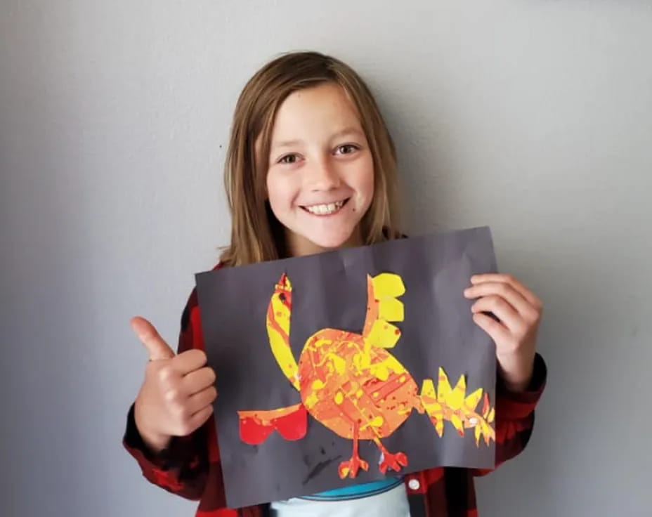 a girl holding a painting