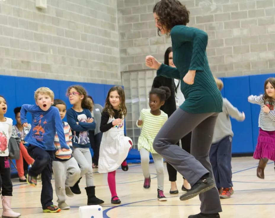 a person dancing with children