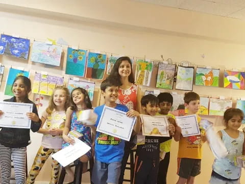 a group of children holding certificates