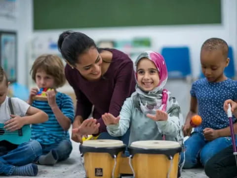 a person and several children playing drums