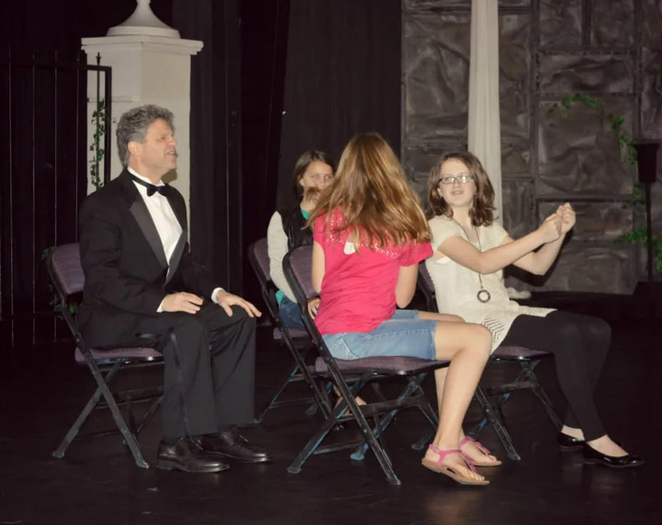 a group of people sitting in chairs