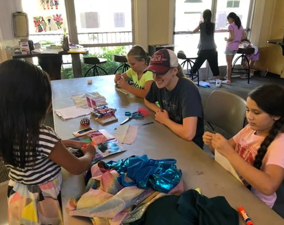 a group of people sitting around a table