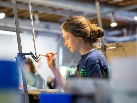 a person working on a piece of string