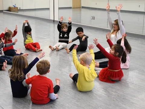 a group of children sitting on the floor