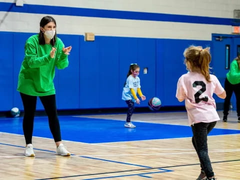 a group of people playing volleyball