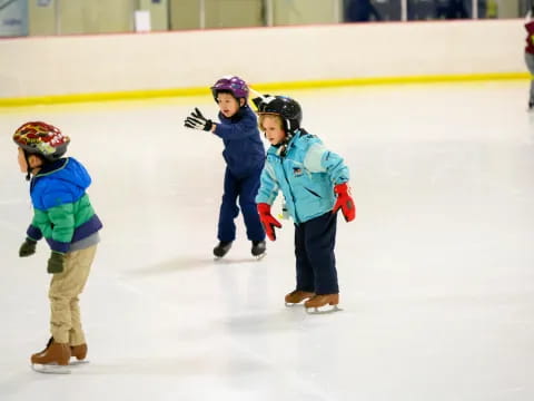 a group of kids on an ice rink