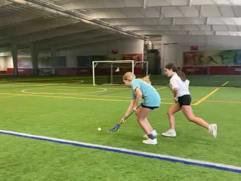a couple of women playing a sport