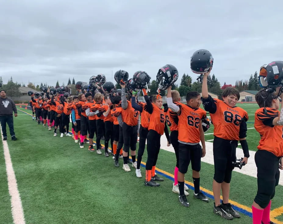 a group of kids wearing helmets