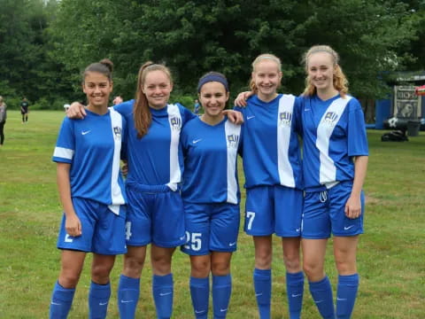 a group of girls in sports uniforms