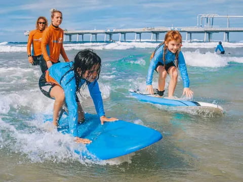 a group of people surfing in the sea