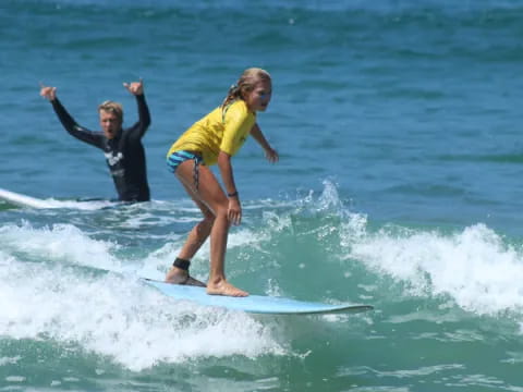 a man and a woman surfing