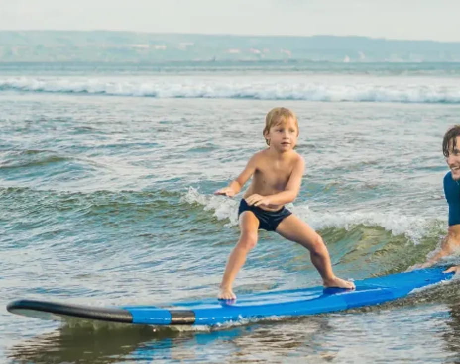 kids on surfboards in water